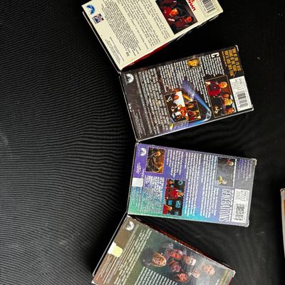 Sale Photo Thumbnail #25: Four vintage Star Trek VHS tapes, including Star Trek II: The Wrath of Khan, Star Trek VI: The Undiscovered Country, Star Trek Generations, and Star Trek: First Contact, showing some wear on the cardboard sleeves.