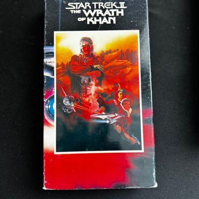 Sale Photo Thumbnail #21: Vintage VHS tape of Star Trek II: The Wrath of Khan, showing some edge wear on the cardboard slipcase.