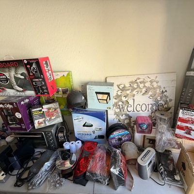 Assortment of boxed home goods and household items including a Morf Board scoot & skate set, a Mr. Coffee maker, small appliances,...