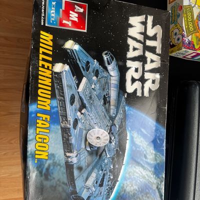 Sale Photo Thumbnail #51: Vintage AMT Ertl Star Wars Millennium Falcon model kit in its original box, showing some shelf wear on the corners.
