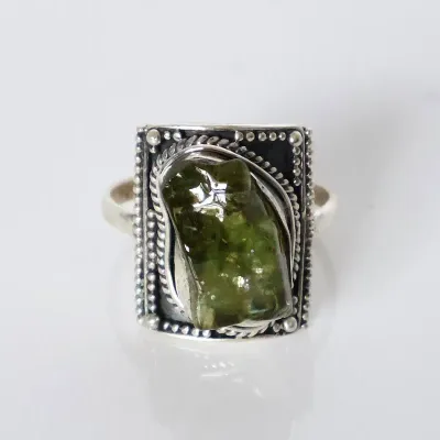 Sale Photo Thumbnail #131: Arisan Stelring Silver Raw Peridot Statement Ring
