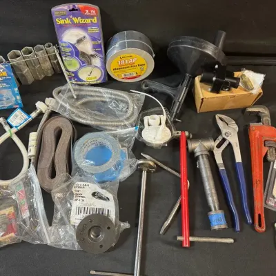 LH547HI - Plumbing Mystery Lot: Tools/Fittings/Repair Supplies