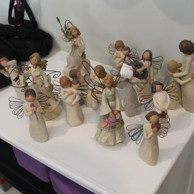 Sale Photo Thumbnail #15: Collection of Willow Tree and similar style resin figurines, featuring various angels and family figures with wire wings.