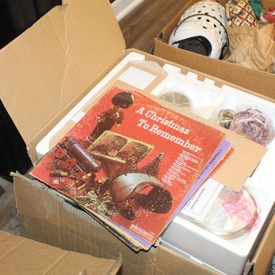 Sale Photo Thumbnail #27: Vintage "A Christmas To Remember" vinyl record album resting on top of a boxed item, surrounded by other boxes of holiday decorations.