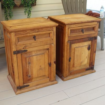 Sale Photo Thumbnail #19: Pair of rustic pine nightstands or end tables, featuring a single drawer over a cabinet door with dark metal hardware.