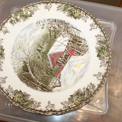 Sale Photo Thumbnail #36: Vintage Johnson Brothers 'The Friendly Home' transferware plate, featuring a winter scene with a covered bridge and a decorative floral border.