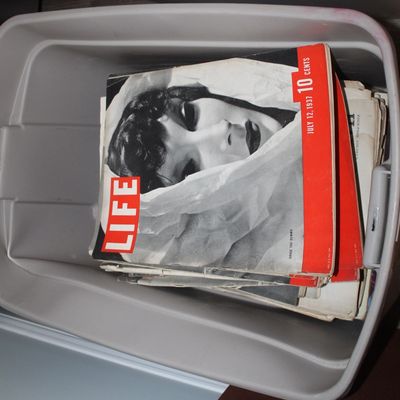 Sale Photo Thumbnail #14: A stack of vintage Life magazines stored in a grey plastic bin, featuring the July 12, 1937 issue on top.