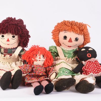 Group of Raggedy Ann Dolls and Books.