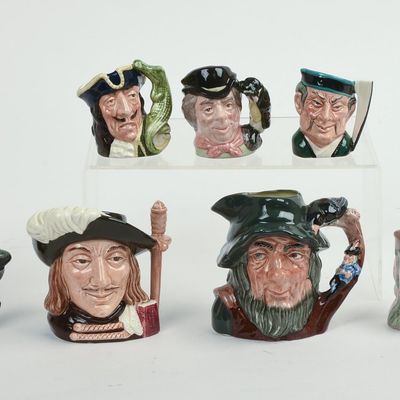Sale Photo Thumbnail #135: Eight Miniature Royal Doulton Character Pitchers.