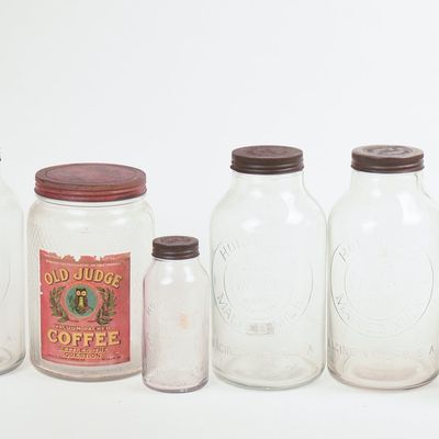 Sale Photo Thumbnail #71: Eight Glass Advertising Jars.
