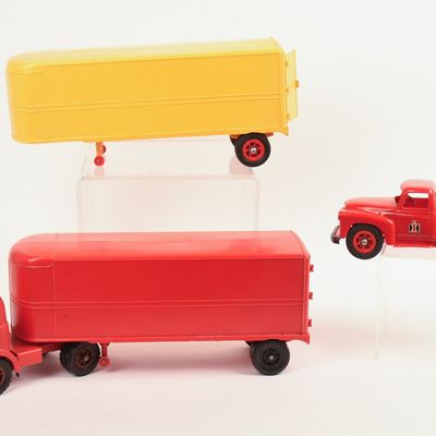 Sale Photo Thumbnail #104: Two International Toy Trucks and a Trailer.
