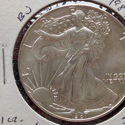 Sale Photo Thumbnail #135: 1987 American Silver Eagle One Troy Oz. .999 Fine Silver