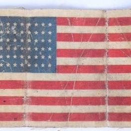 Sale Photo Thumbnail #377: SIGNED WWII US PARATROOPER FLAG OILCLOTH ARMBAND