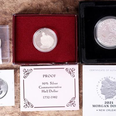 Sale Photo Thumbnail #350: ASSORTED SILVER U.S. COMMEMORATIVE COIN/ ROUNDS(4)