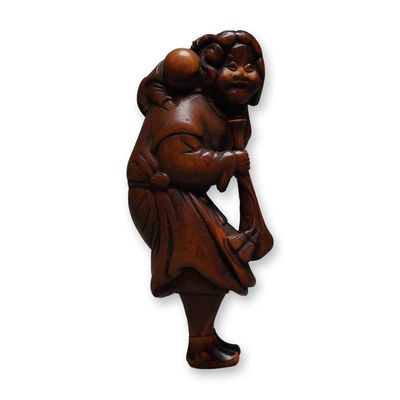 Sale Photo Thumbnail #248: Wood Netsuke, Dutchman with Boy and Trumpet, Signed