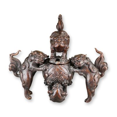 Sale Photo Thumbnail #503: 19th Century Chinese Patinated Bronze Tripod Censer with Relief Dragon Motifs