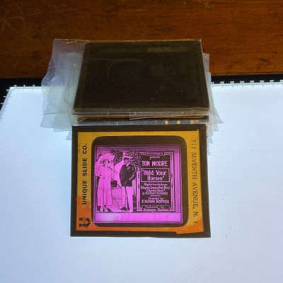 Collection of Vintage Hand-Colored Glass Lantern Slides for Silent Films and Advertisements
