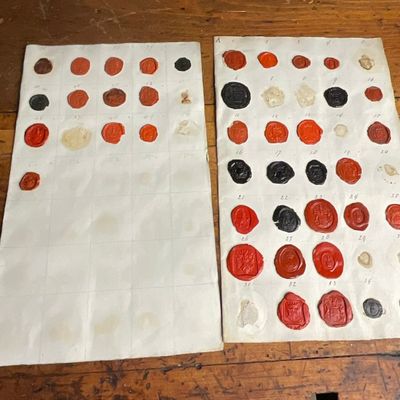 Late 18th to Mid-19th Century Two Paper Sheets Containing a Collection of Armorial Wax Seal Impressions