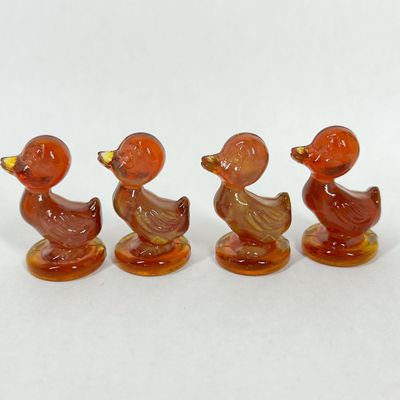 Sale Photo Thumbnail #394: SET OF BOYD GLASS DEBBIE DUCK AMBERINA SLAG FIGURINES