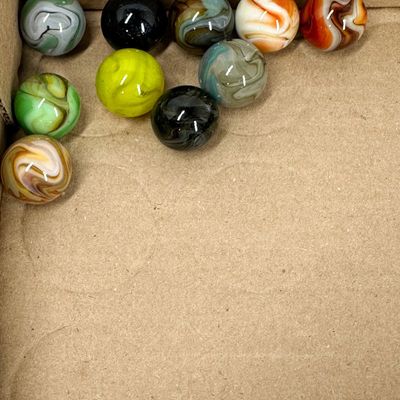 Sale Photo Thumbnail #308: AN ASSORTMENT OF ELEVEN MACHINE-MADE GLASS SWIRL MARBLES