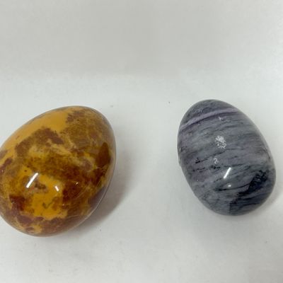 Sale Photo Thumbnail #215: TWO POLISHED MOOKAITE AND FLUORITE EGGS