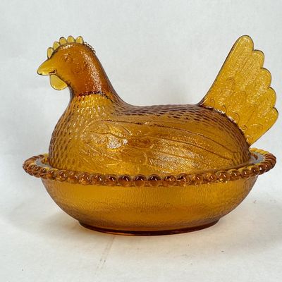 Sale Photo Thumbnail #338: INDIANA AMBER GLASS HEN ON NEST DISH