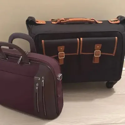 1 Hartmann & 1 Tumi luggage
