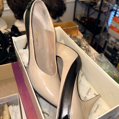 Pair of Sacha London two-tone beige and black leather high-heeled pumps in original shoe box, appearing in good condition.
