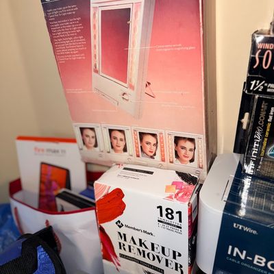 Vintage Clairol True-to-Light makeup mirror in its original box, displayed alongside a box of Member's Mark makeup remover towelettes.