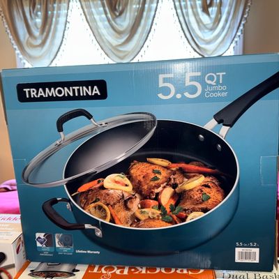 Tramontina 5.5-quart Jumbo Cooker in its original box, displayed alongside other boxed kitchen appliances including a Crock-Pot Smart-Pot.