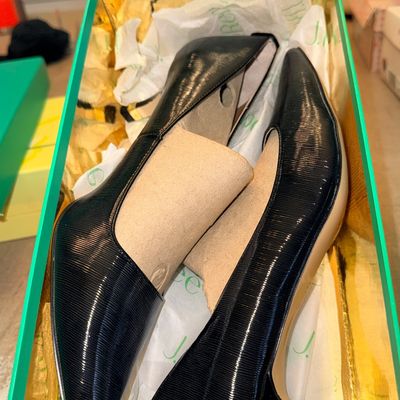 Pair of J. Renee black ribbed faux-leather pointed-toe pumps, unused with original cardboard shoe shapers in box.