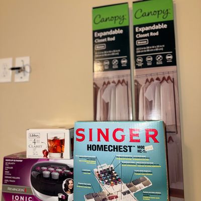 Selection of boxed home goods including a vintage Singer Homechest sewing organizer kit, a Remington ionic hair roller set, a Libbey...