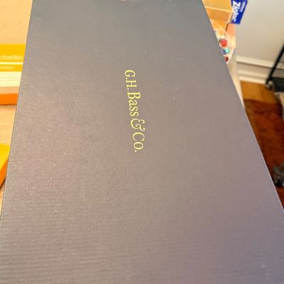 G.H. Bass & Co. shoe box with gold lettering on a dark lid.
