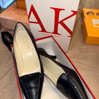 Pair of black leather AK Anne Klein iFlex pointed-toe low heels in their original box.