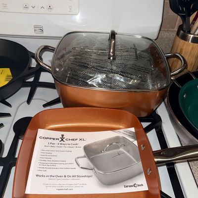 Copper Chef XL square pan set including a deep roasting pot with glass lid and fry basket, along with a matching square skillet...