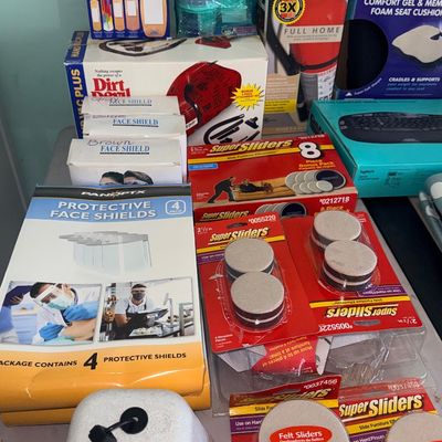 Collection of boxed household goods and personal protective supplies including Super Sliders furniture movers, Panoptx face shields, a...