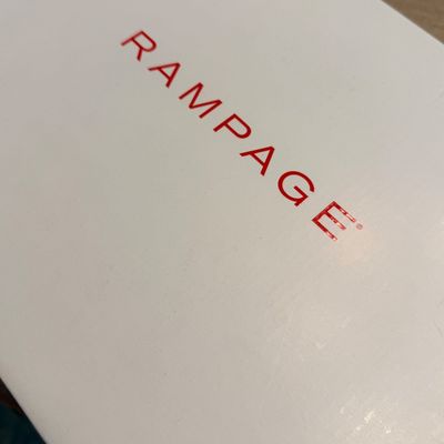 White Rampage brand shoe box featuring red embossed lettering on the lid.