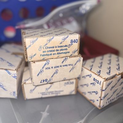Collection of vintage Princess House lead crystal items in their original cardboard packaging, including a rocking horse figurine made in...