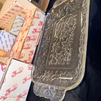 Vintage Princess House Fantasia clear glass rectangular serving tray with raised poinsettia floral detail and integrated side handles.