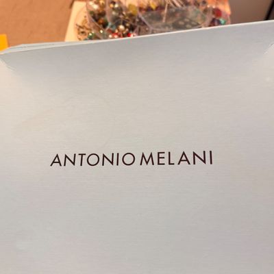 Light blue Antonio Melani designer box, showing mild surface wear.