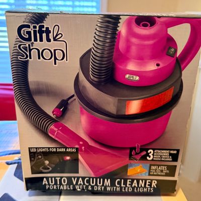 Gift Shop brand portable hot pink auto vacuum cleaner, boxed new with 12V plug and attachment heads.