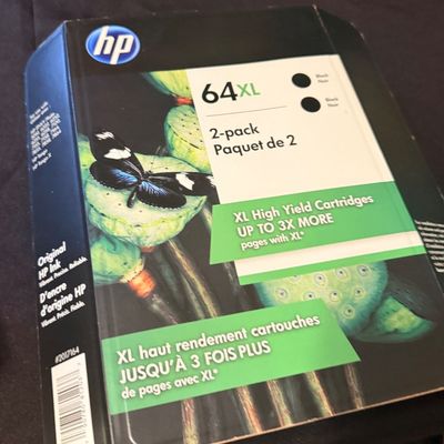 Sealed 2-pack box of original HP 64XL high-yield black ink cartridges.