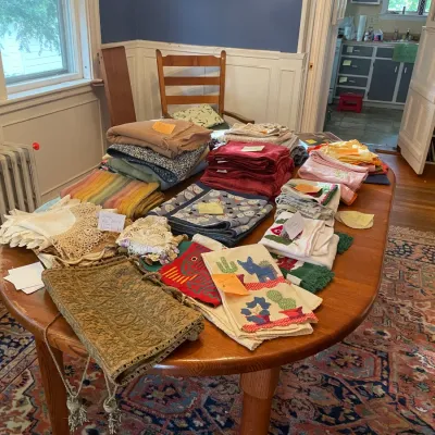 Sale Photo Thumbnail #19: wooden table with assorted tablelinens