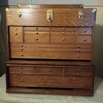 Sale Photo Thumbnail #96: Gerstner & Sons style oak machinist tool chest and base cabinet, featuring brass hardware and numerous felt-lined drawers.