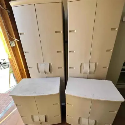 Sale Photo Thumbnail #52: Two tall and two short Rubbermaid beige plastic storage cabinets with double doors, showing some light wear from garage or outdoor use.