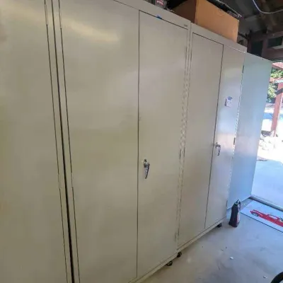 Sale Photo Thumbnail #120: Large beige metal storage cabinets on wheels, suitable for garage or workshop organization.