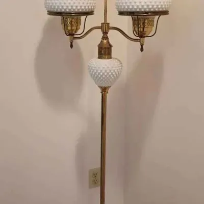 Sale Photo Thumbnail #163: Vintage Fenton hobnail milk glass double student floor lamp with a brass pole and glass chimneys.