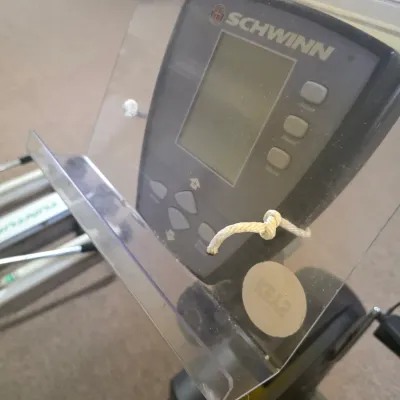 Sale Photo Thumbnail #198: Schwinn exercise machine console with an attached clear acrylic book or tablet holder.