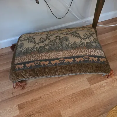 Sale Photo Thumbnail #80: Large rectangular floor pillow featuring a safari-themed tapestry design with elephants, leopards, and monkeys, finished with corner tassels.