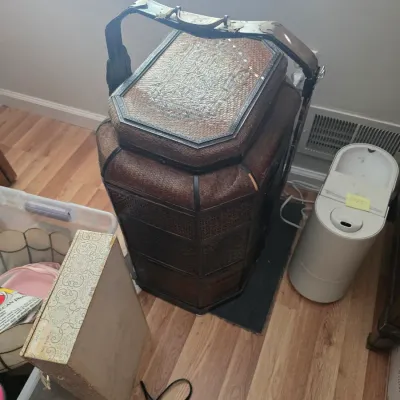 Sale Photo Thumbnail #121: Vintage Chinese wedding basket featuring a multi-tiered woven rattan design with a wooden carrying handle.